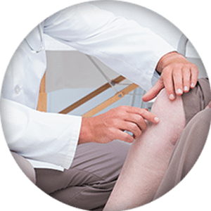 Doctor examining a patients knee 